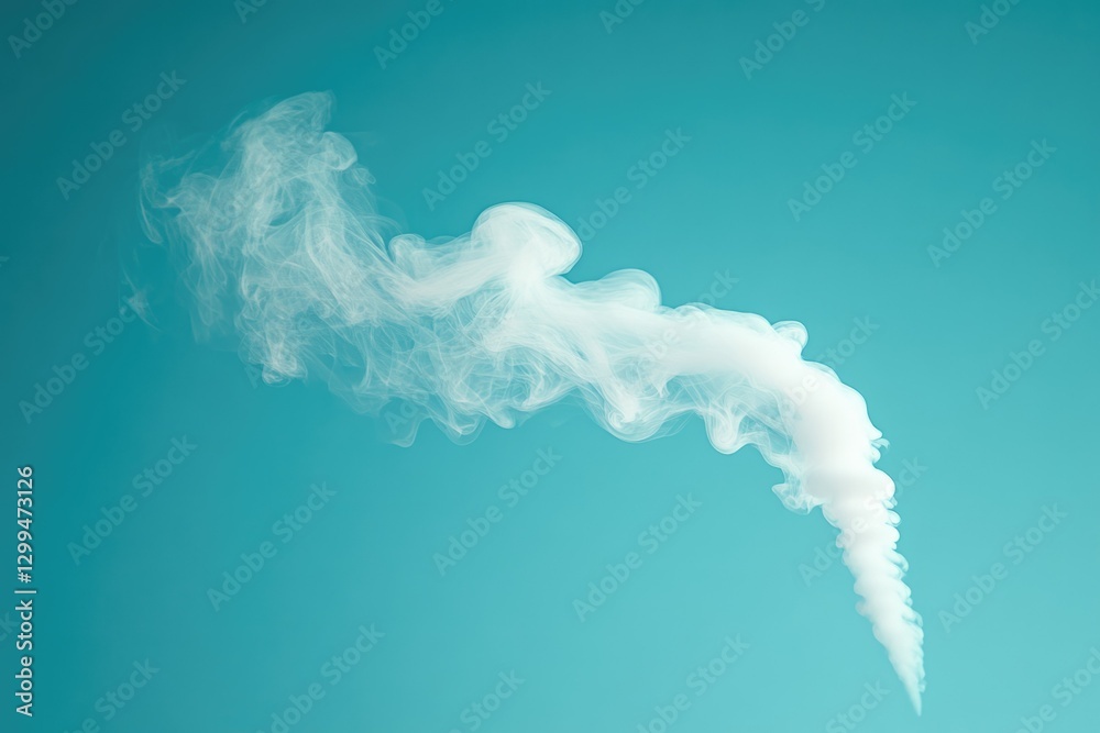 Naklejka premium White smoke billows against a vibrant teal backdrop, creating an abstract, ethereal scene.