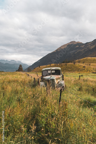 Old and rusty abandoned car on a field