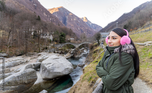 Woman Enjoying Scenic Winter View at Ponte Dei Salti in Ticino photo