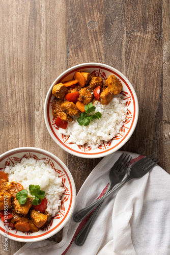 Top view of Hungarian pork goulash with rice in bowls photo