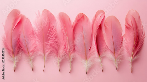 Soft pink feathers arranged in a delicate row on a pink background create a calming and elegant pattern.  AI generative photo