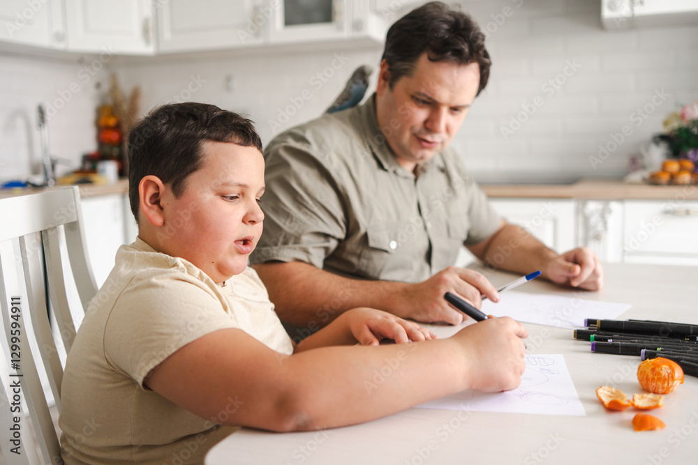 Father and son bonding over art in a cozy kitchen setting Father and son bonding over art in a cozy kitchen setting