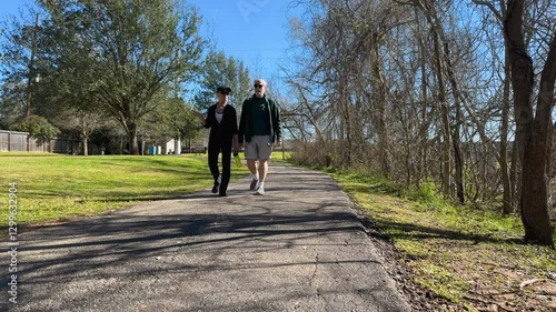 senior couple walking in the park