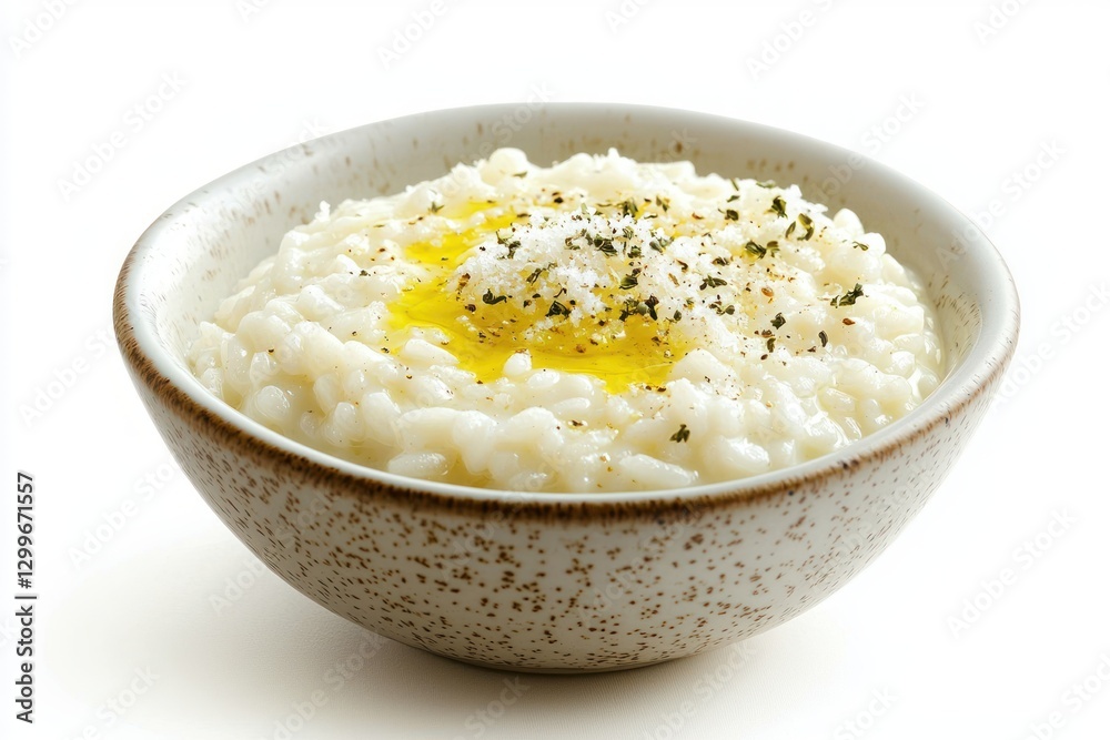 Creamy risotto in a rustic speckled bowl garnished with herbs parmesan and olive oil delicious dish Creamy risotto in a rustic speckled bowl garnished with herbs parmesan and olive oil delicious dish