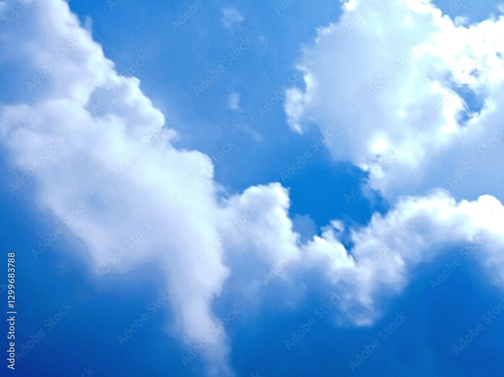 Obraz premium Clouds in the blue sky as a symbol of hope and peace 