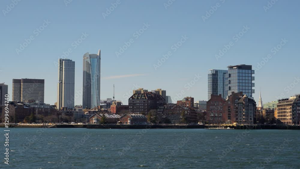 View of beautiful Boston cityscape skyline seen from Piers Park on a cold clear winter afternoon View of beautiful Boston cityscape skyline seen from Piers Park on a cold clear winter afternoon