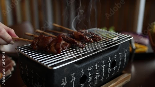 cooking outdoor as we camp on a mountain surrounded by abundant nature, family members are helping to cook both barbecue and grilled food, including meat and vegetables, close-up