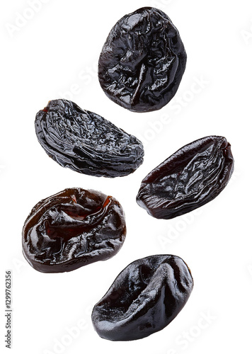 Dried Pruness falling apart, isolated on white background.