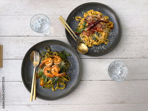 shrimp and pasta served on a plate