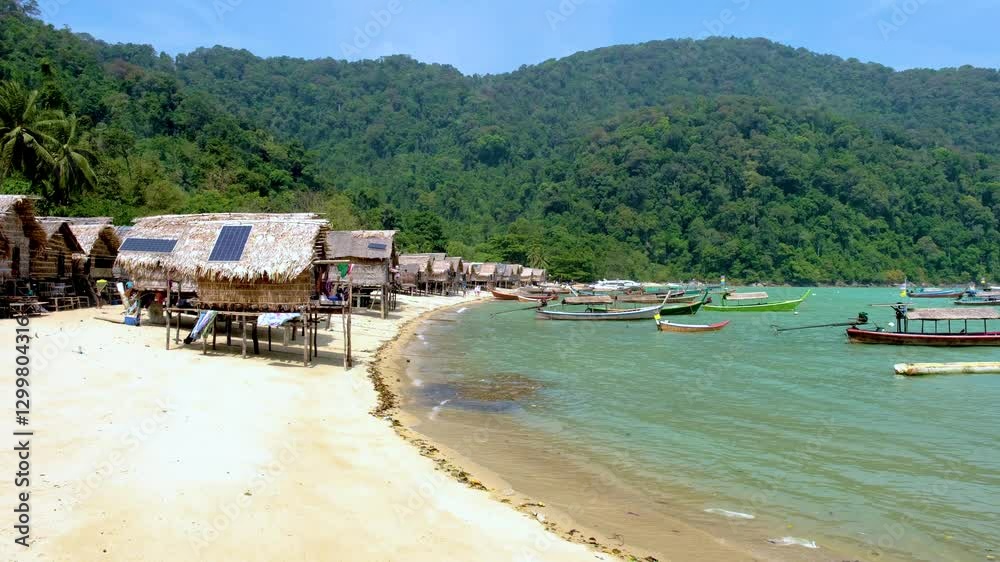 Explore the tranquil shores of Surin Island Thailand, where tropical landscapes meet traditional village life. Experience the harmonious blend of nature and culture at the Moken villag