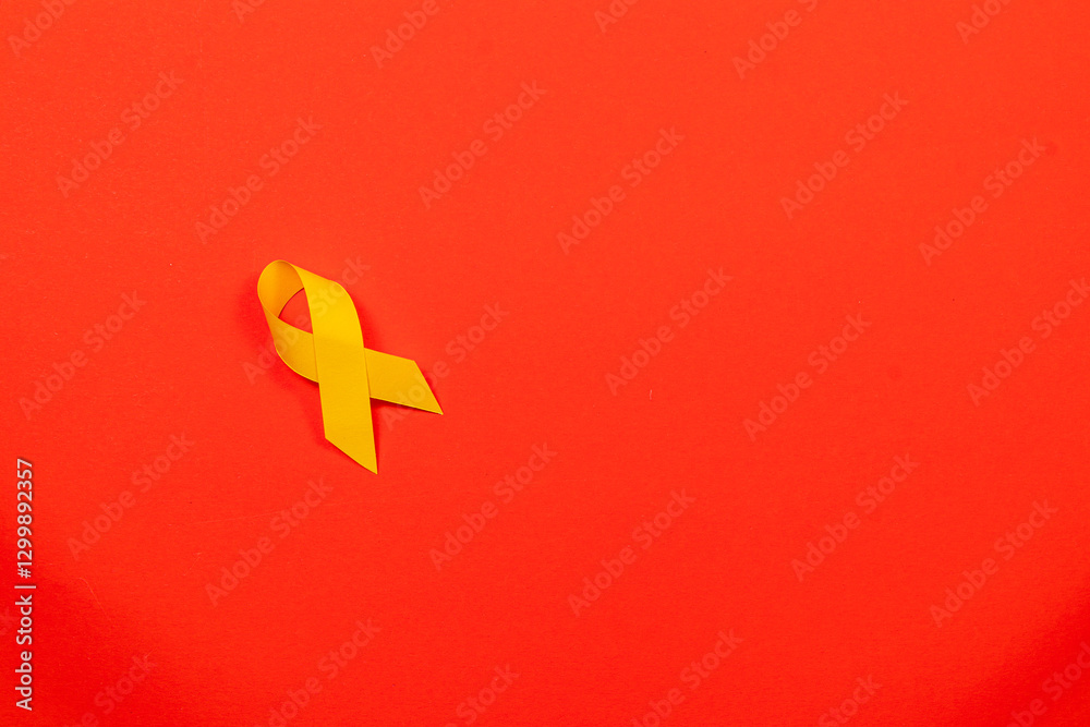 Obraz premium Yellow ribbon symbolizes awareness for cancer support and health campaigns