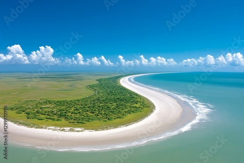 A dramatic aerial perspective of a curved sandbar peninsula forming a perfect crescent