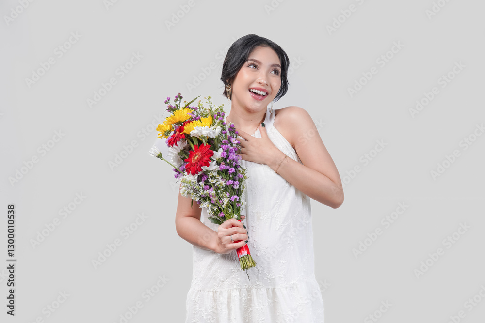 Happy mindful pregnant Asian woman holding a bouquet of flowers feeling relieved. Happy mindful pregnant Asian woman holding a bouquet of flowers feeling relieved.