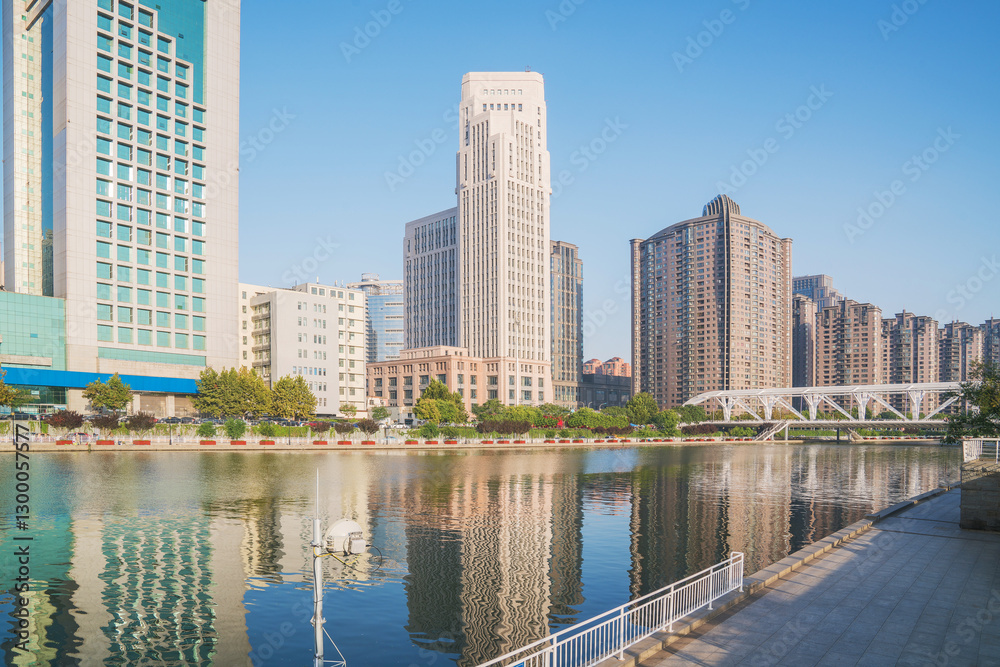 Obraz premium The urban architectural skyline, modern bridges, and Haihe River scenery of Tianjin, China on August 11, 2024