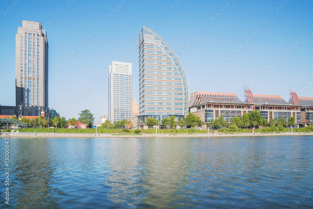 Naklejka premium The urban architectural skyline, modern bridges, and Haihe River scenery of Tianjin, China on August 11, 2024