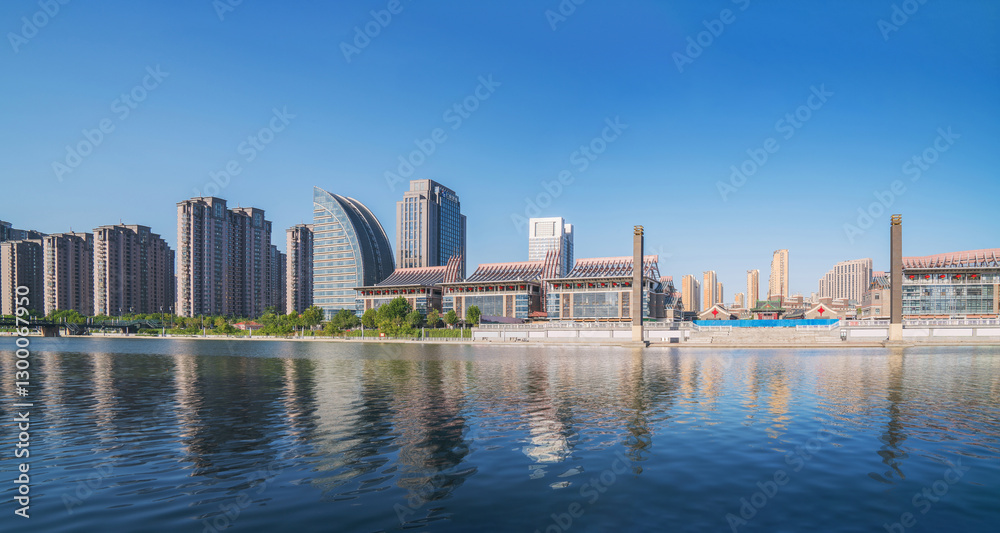 Naklejka premium The urban architectural skyline, modern bridges, and Haihe River scenery of Tianjin, China on August 11, 2024