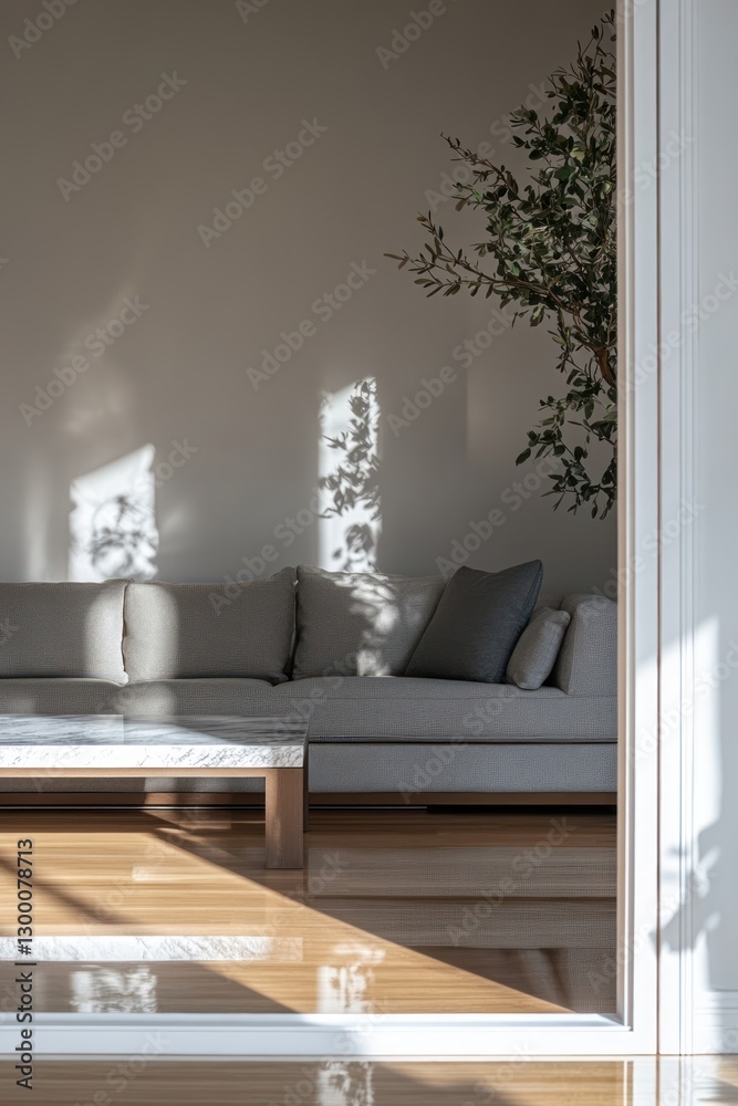 Fototapeta premium A modern living room with a gray sectional, a marble coffee table,.