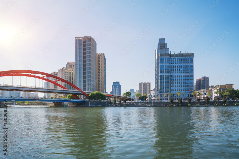 Naklejka premium The urban architectural skyline, modern bridges, and Haihe River scenery of Tianjin, China on August 11, 2024