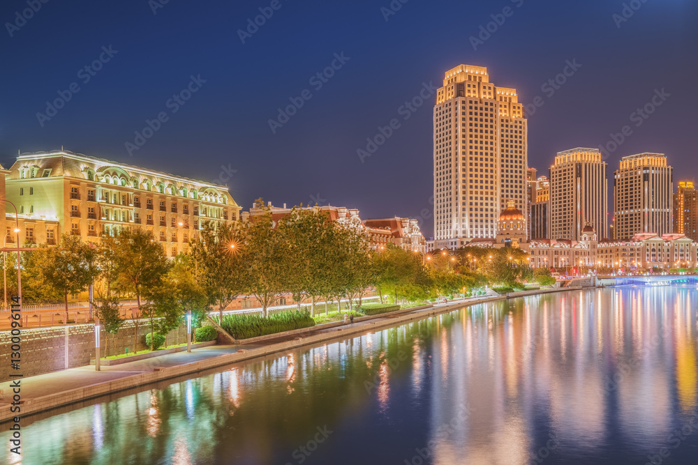 Fototapeta premium The urban architectural skyline, modern bridges, and Haihe River night scenery of Tianjin, China on August 11, 2024