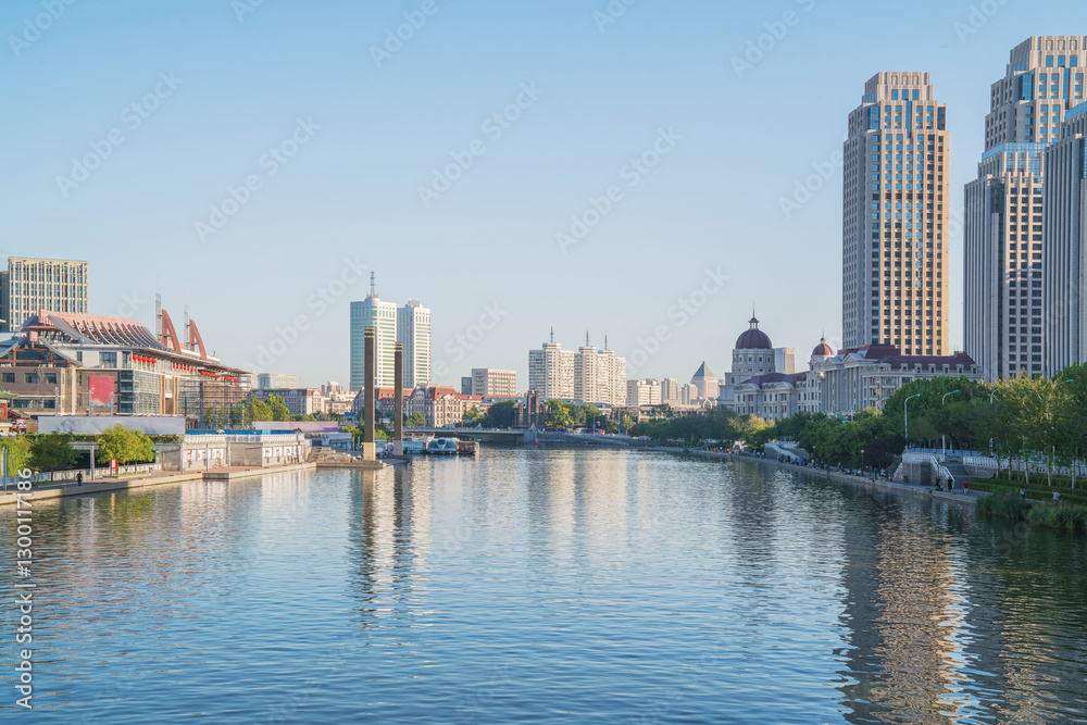 Obraz premium The urban architectural skyline, modern bridges, and Haihe River scenery of Tianjin, China on August 11, 2024