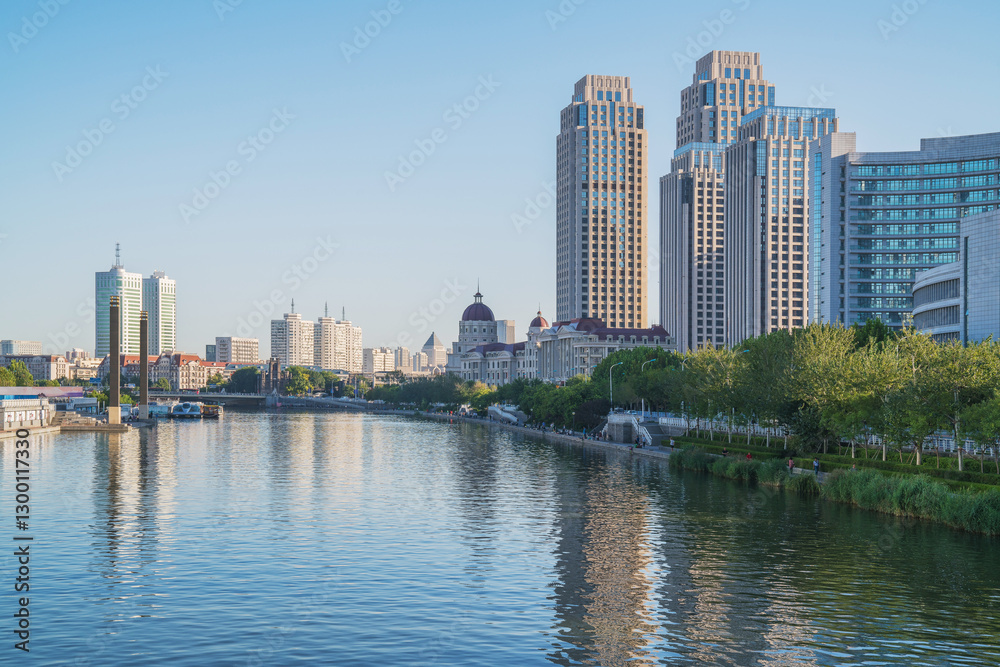 Obraz premium The urban architectural skyline, modern bridges, and Haihe River scenery of Tianjin, China on August 11, 2024
