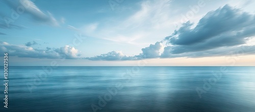 Wallpaper Mural Serene seascape at dusk featuring soft blue and turquoise hues with gentle waves, distant clouds and a tranquil horizon under a pastel sky Torontodigital.ca