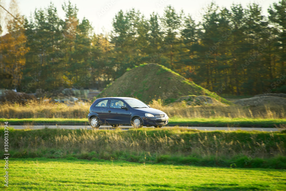 Fototapeta premium Eco-friendly vehicle on grassy roadside