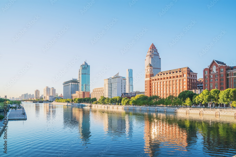 Naklejka premium The urban architectural skyline, modern bridges, and Haihe River scenery of Tianjin, China on August 11, 2024