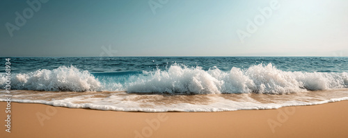Ocean's Embrace: A panoramic view of a beautiful beach with the waves crashing on the shore.