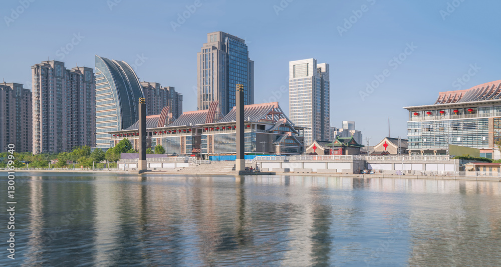 Obraz premium The urban architectural skyline, modern bridges, and Haihe River scenery of Tianjin, China on August 11, 2024