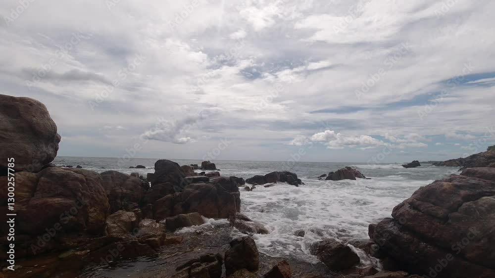 Timelapse of Waves Crashing Against Rocks at Secret Beach, Mirissa, Sri Lanka Timelapse of Waves Crashing Against Rocks at Secret Beach, Mirissa, Sri Lanka