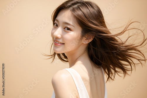 Headshot of a woman with her hair blowing softly in the wind as she turns around, AI-generated