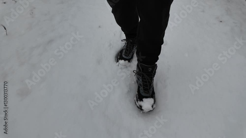 A man walks through the snow