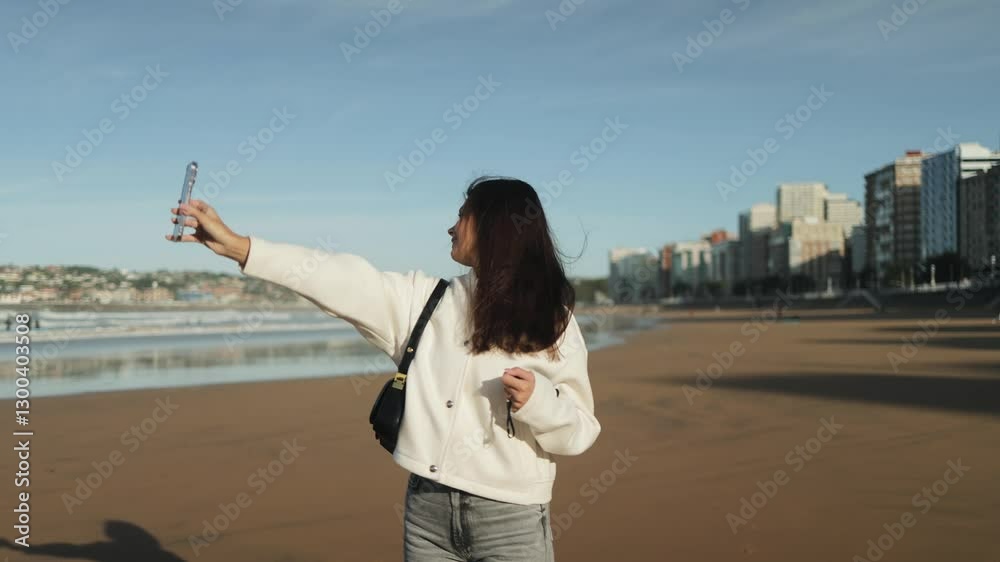 Cute girl, woman takes a selfie on the phone on the ocean coast, on the city beach, beauty, lightness, media, social networks, smile, life, emotions, joy, happiness, share, content Cute girl, woman takes a selfie on the phone on the ocean coast, on the city beach, beauty, lightness, media, social networks, smile, life, emotions, joy, happiness, share, content