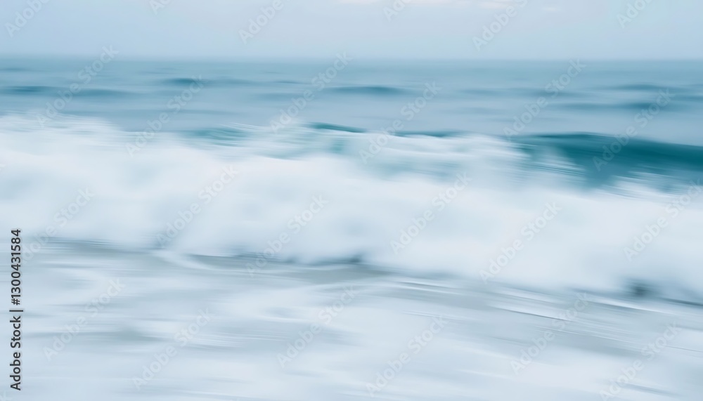 The blurred ocean waves gently crashing towards the shoreline softly The blurred ocean waves gently crashing towards the shoreline softly