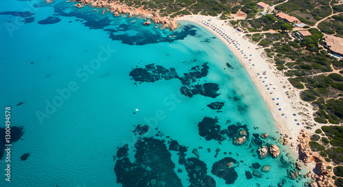 Aerial View of Tropical Beach with Turquoise Water and Rocky Shoreline