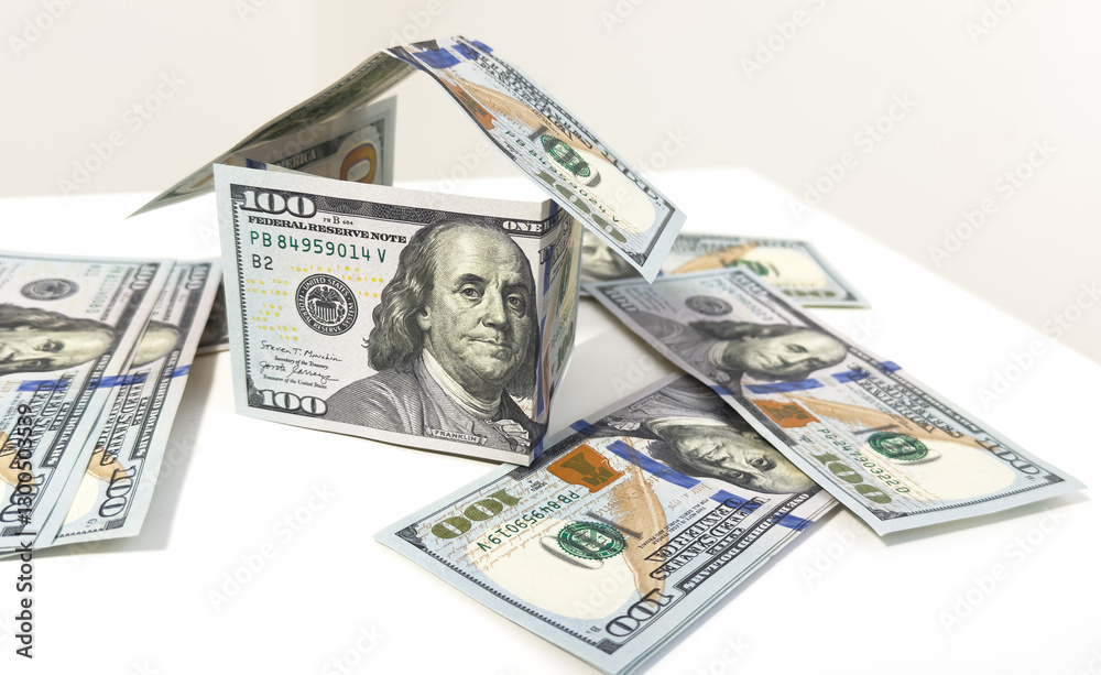 Money house dollar bill real estate isolated on white business finance wealth investment currency background of residential building property home mortgage concept or financial economy banking market. Money house dollar bill real estate isolated on white business finance wealth investment currency background of residential building property home mortgage concept or financial economy banking market.