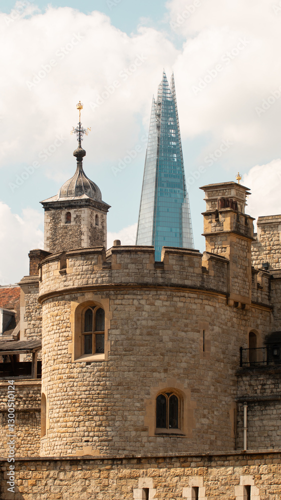 Obraz premium The Shard skyscraper and an old castle-like building in London
