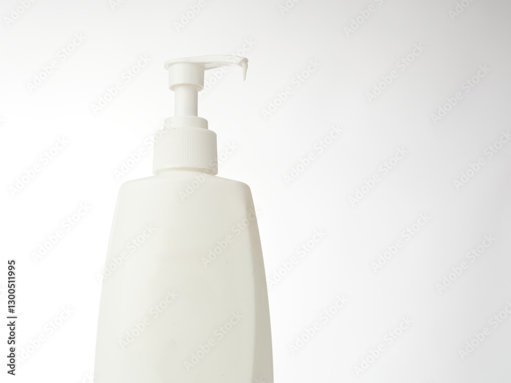 White Lotion Bottle on an Isolated Background Showcasing Sleek Design and Functional Pump White Lotion Bottle on an Isolated Background Showcasing Sleek Design and Functional Pump