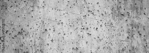 Textured Grey Canvas: An abstract textured close-up of a worn grey canvas reveals a complex pattern of imperfections. The canvas's character is enhanced by the subtle interplay of light and shadow.