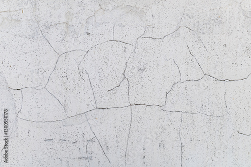 Light cracked wall. Minimalistic soft wall texture with cracked details.