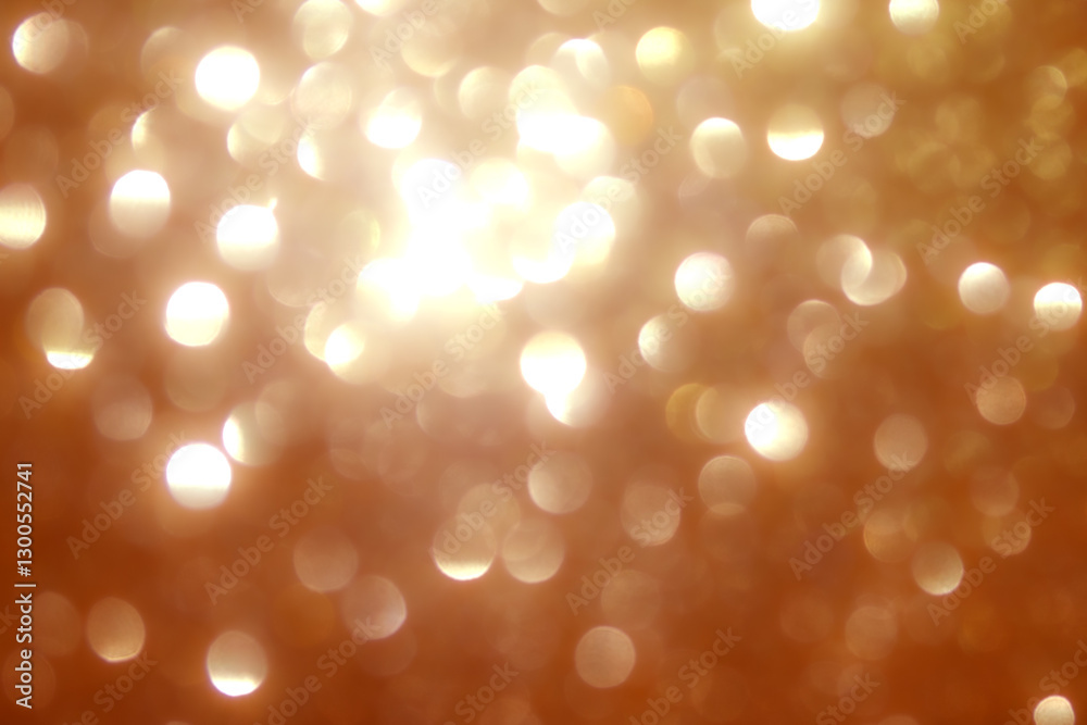 Obraz premium Soft golden lights shimmer in the background, creating a festive ambiance. The blurred effect adds a dreamy quality, perfect for evening gatherings or holiday events.