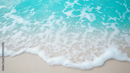 A serene summer seascape showing turquoise waves on a quiet beach, soft natural light illuminating the scene, creating a calming and peaceful atmosphere