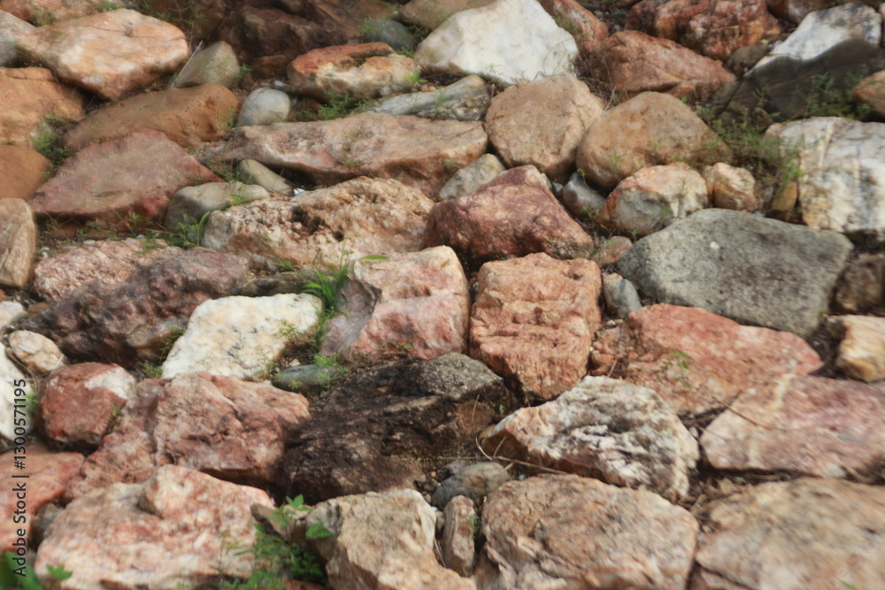 Textured Stone Wall: A rustic and detailed stone wall composed of various sized stones create a textural rich surface that tells a story of resilience. Textured Stone Wall: A rustic and detailed stone wall composed of various sized stones create a textural rich surface that tells a story of resilience.