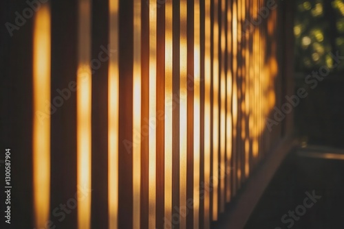 a modern architectural facade featuring sleek vertical cedar slats backlit by warm sunlight creating dramatic shadows minimalist japaneseinspired design with rich amber tones photo