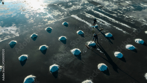 Salt making from sea water in Vietnam is completely handmade. Harvesting salt in Hon Khoi salt field, Khanh Hoa.