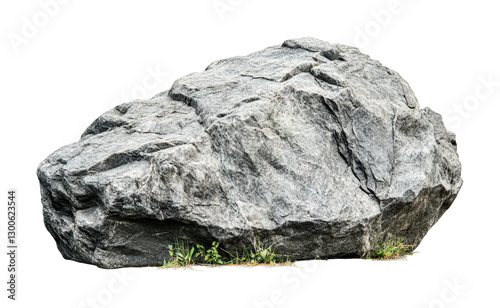Natural stone formation with rugged texture and sparse vegetation at the base for design and artistic purposes, cut out