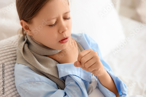 Ill little girl with sore t...