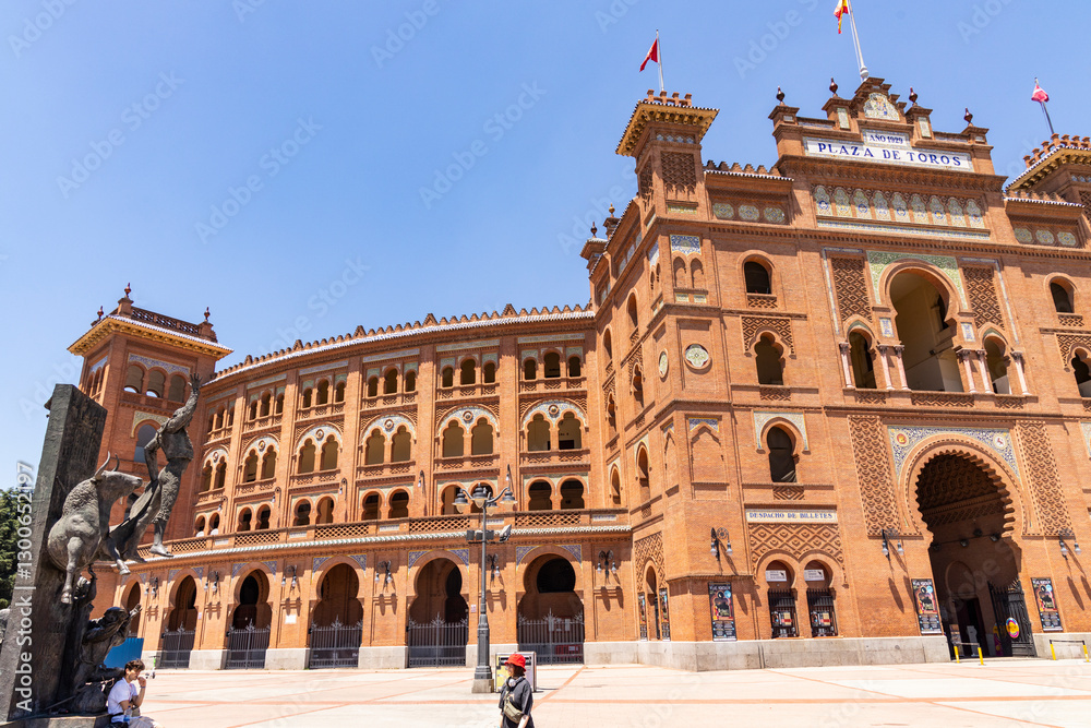Obraz premium Las Ventas bullring, Madrid, Bull square. Plaza de toros. Events and traditions of Spain. Red sand under a burning sun. No people. Fight between matador and bull. Blood, passion, dance, celebration.