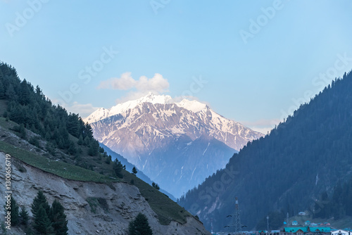 Snow-laden mountain during sunset.